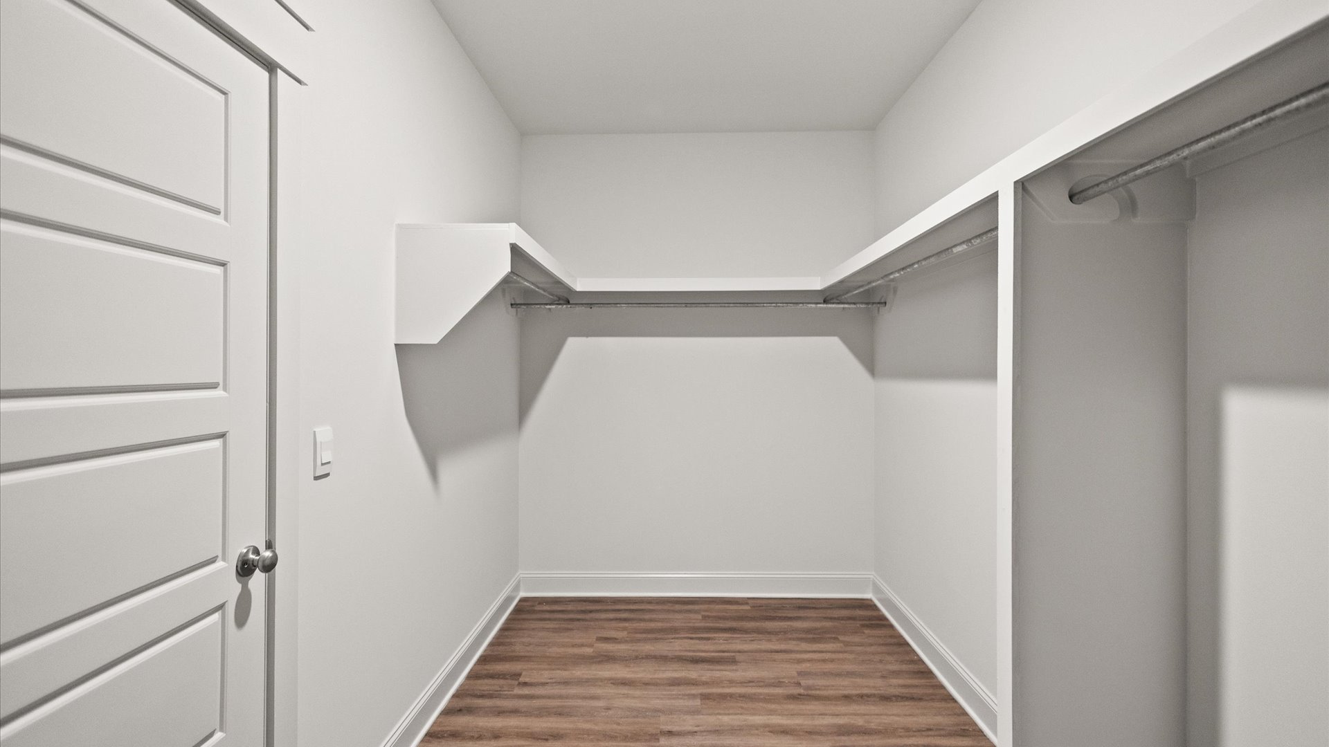 interior walk in closet with some built in shelving