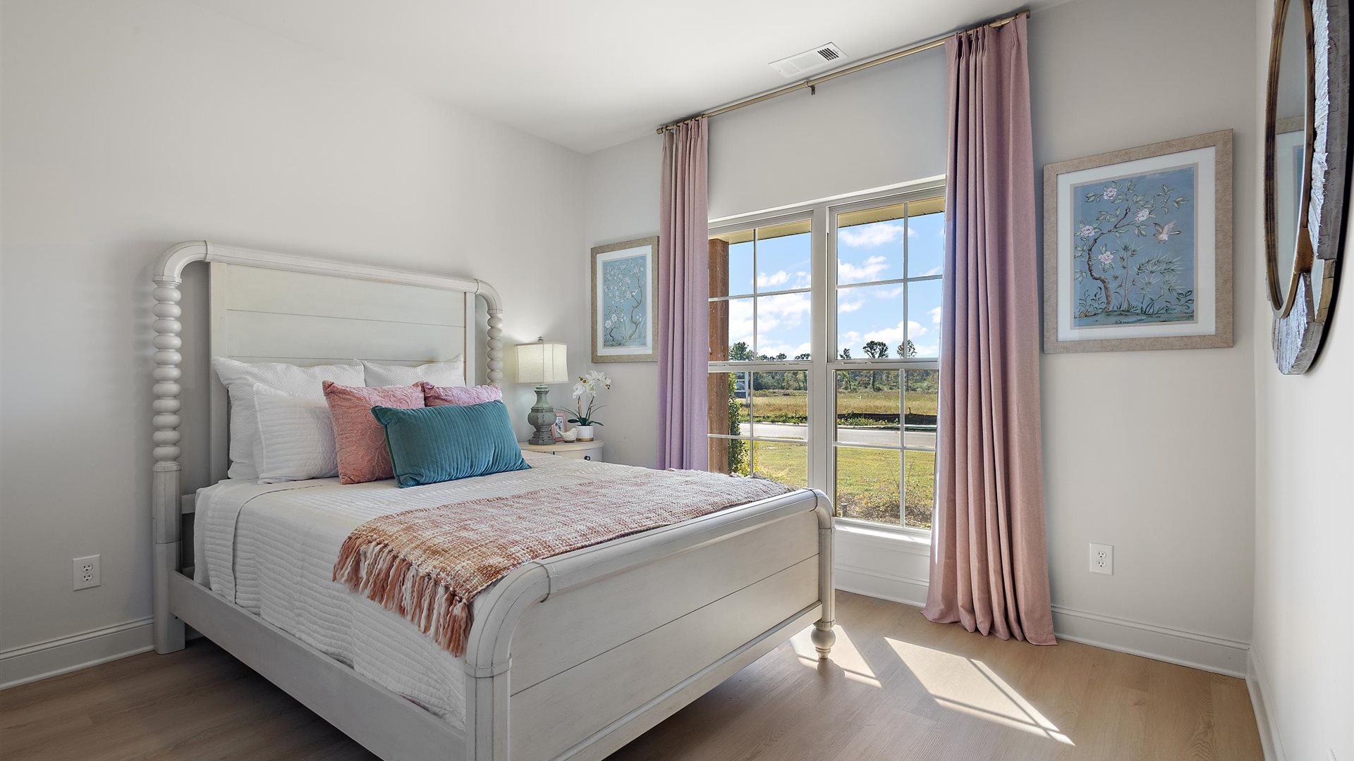 Additional bedroom with window and hardwood floors