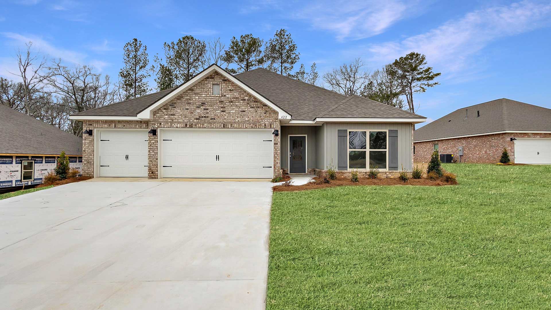 The Destin single-story home with a two-car garage., New home in Pearl, MS.