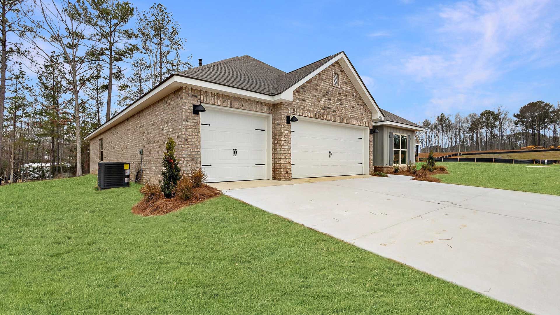 The Destin single-story home with a two-car garage., New home in Pearl, MS.