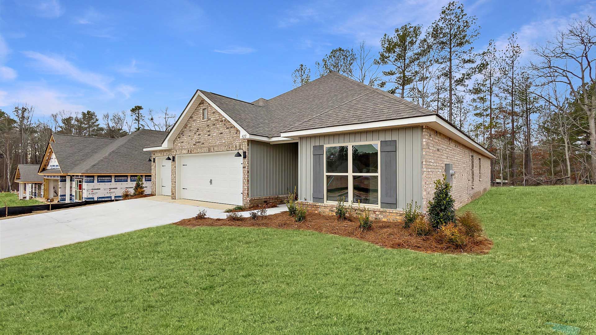 The Destin single-story home with a two-car garage., New home in Pearl, MS.