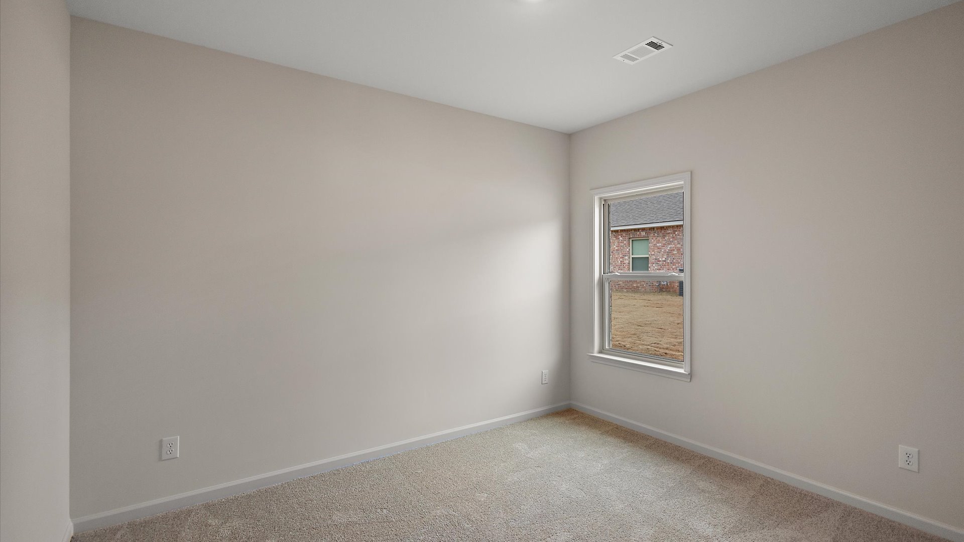 Additonal bedroom with carpeted floors, recessed lighting, and a window for natural light.