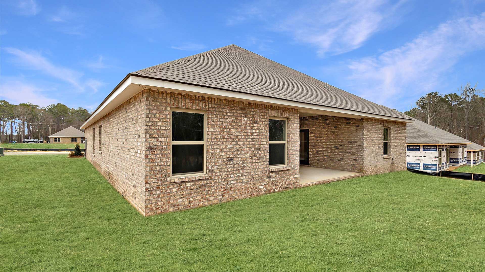 The Destin single-story home with a two-car garage., New home in Pearl, MS.