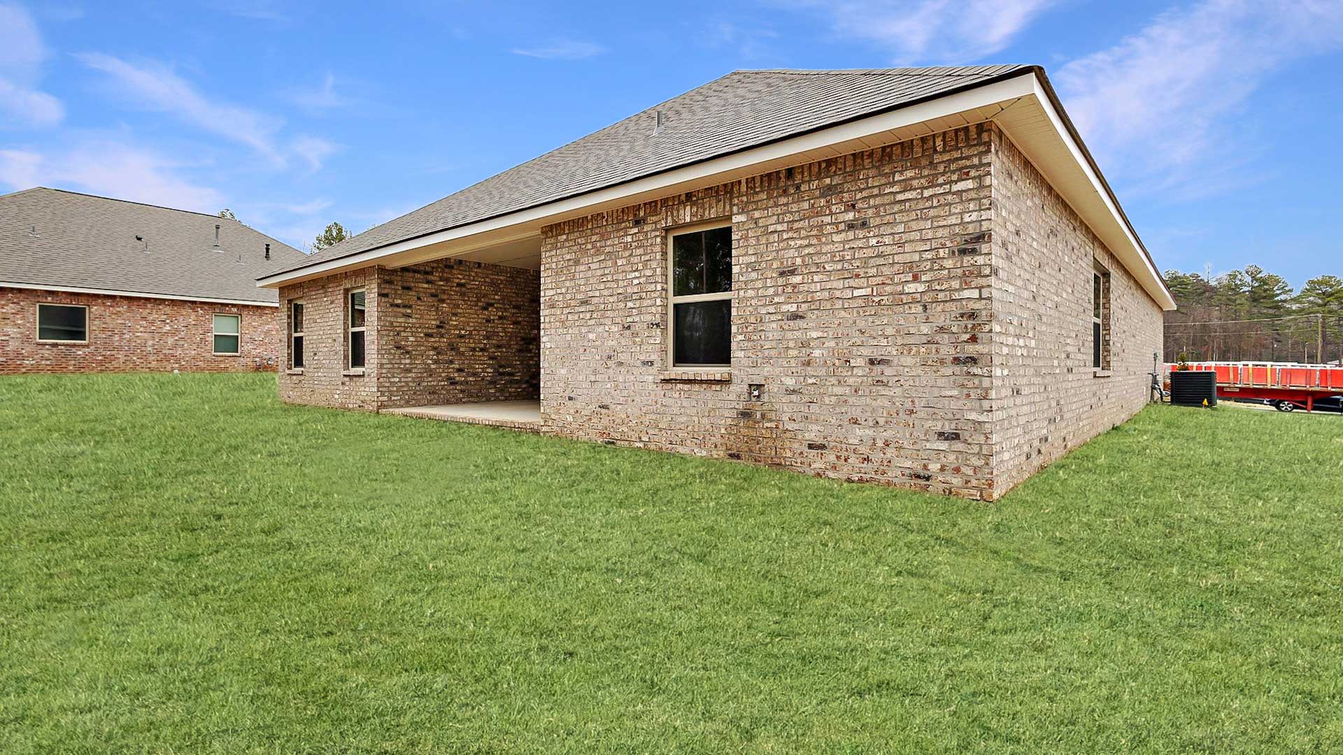 The Destin single-story home with a two-car garage., New home in Pearl, MS.