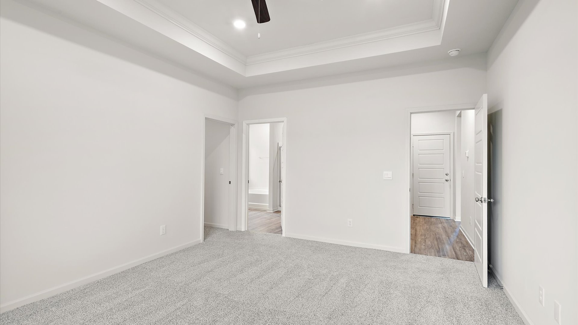 Primary bedroom with carpeted floors