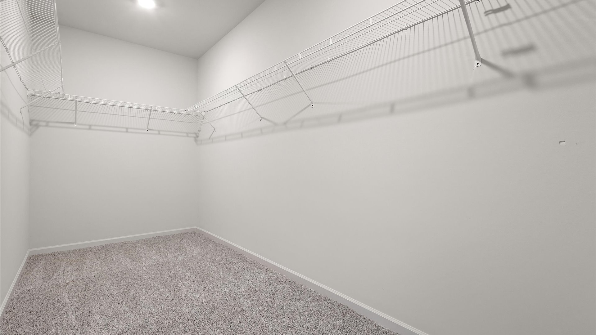 Spacious walk in closet in primary bedroom