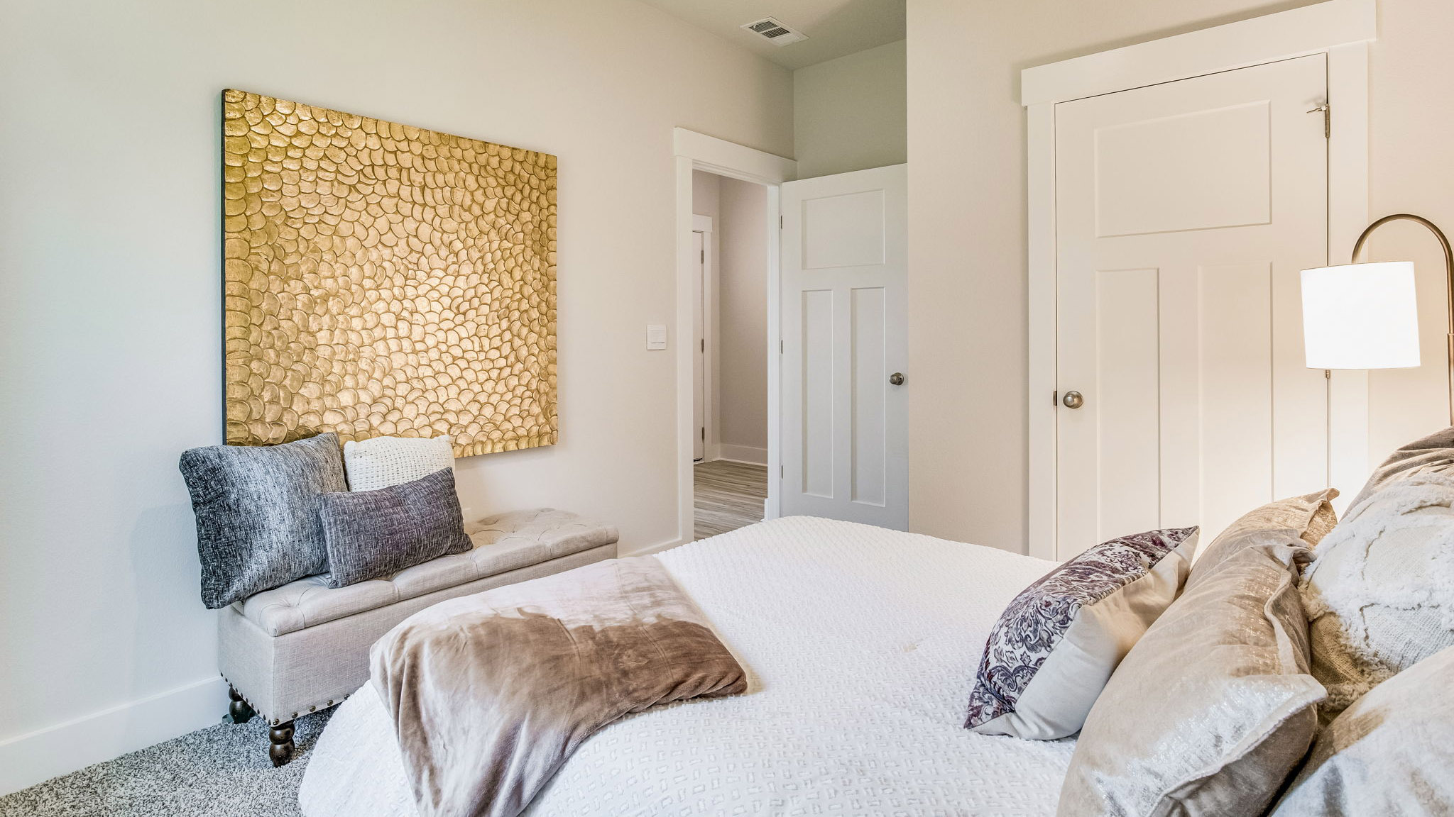 Bedroom with single window and carpeted floors and closet.