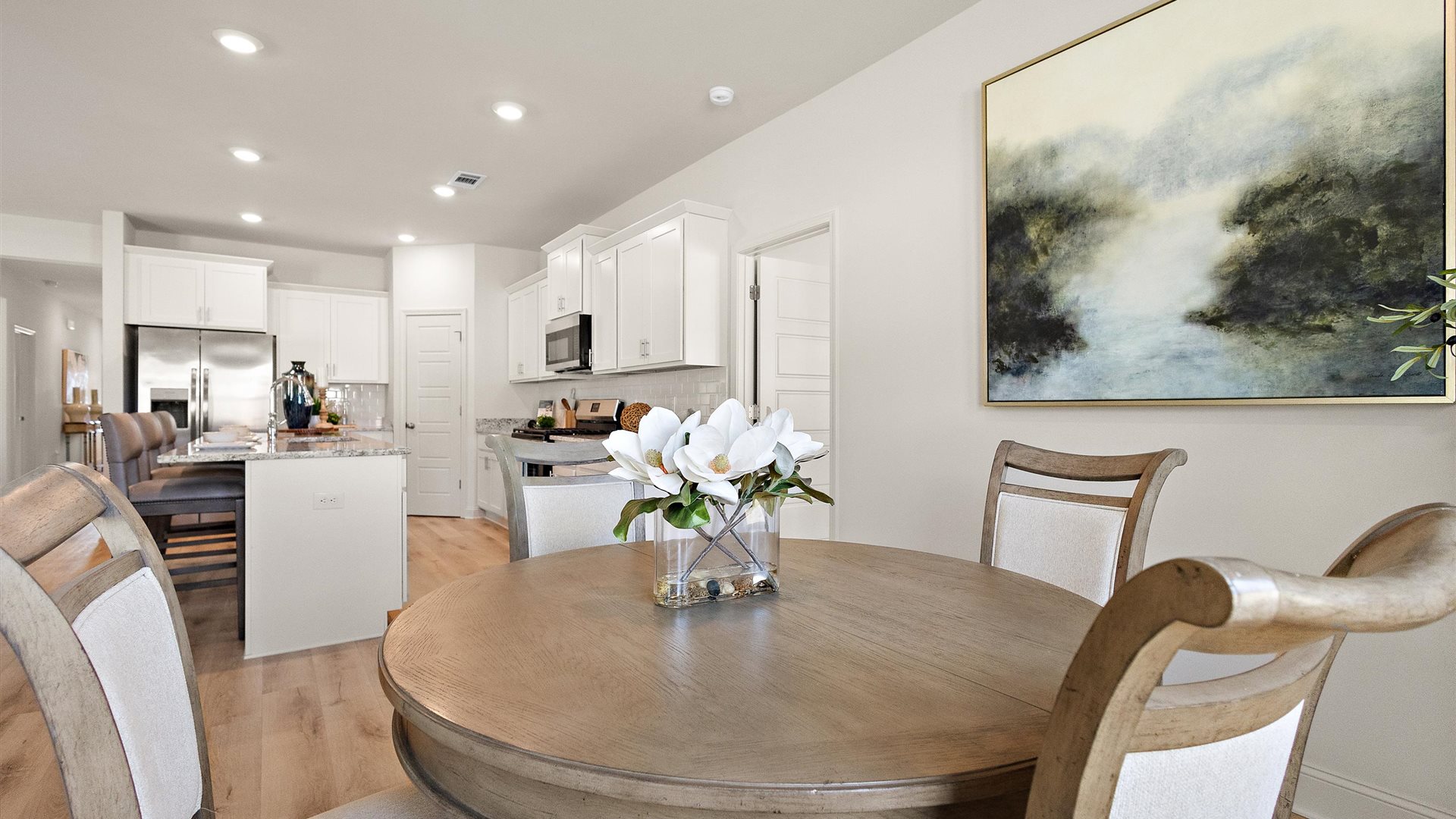 Living room features natural light, with fresh open concept looking to kitchen, front door foyer Horseshoe Bend