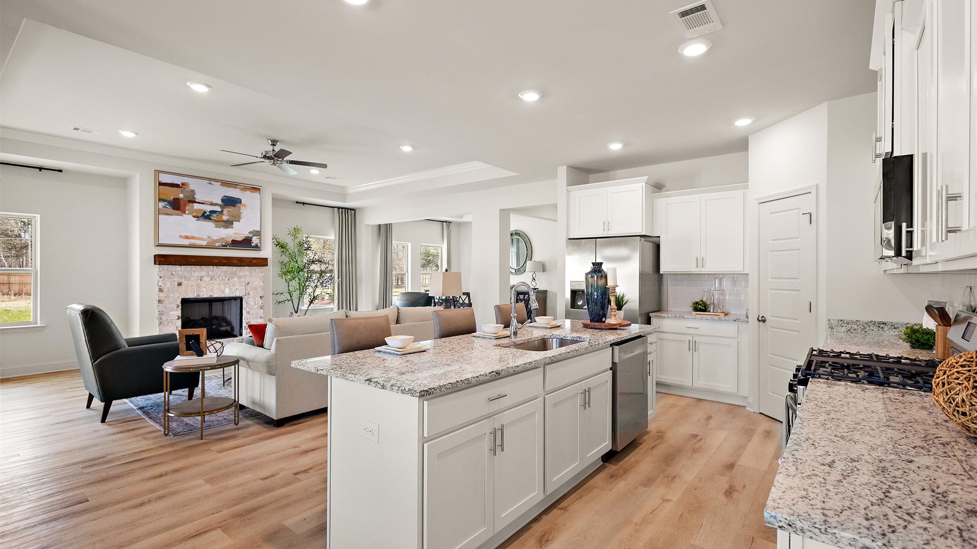 View from kitchen toward dining, living, and backyard areas with outdoor connection Horseshoe Bend