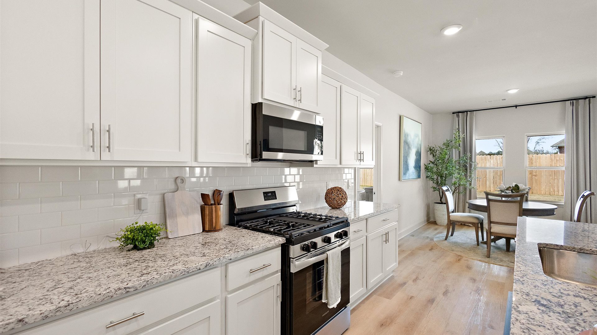 Side view of kitchen to pantry, cabinets, near front door and living areas, appliance suite included  Horseshoe Bend
