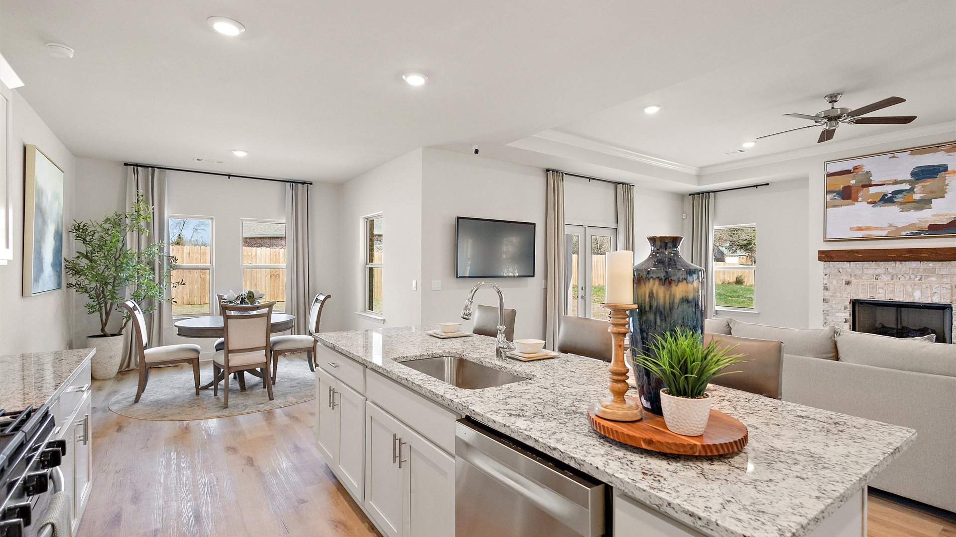 View from kitchen toward dining, living, and backyard areas with outdoor connection Horseshoe Bend