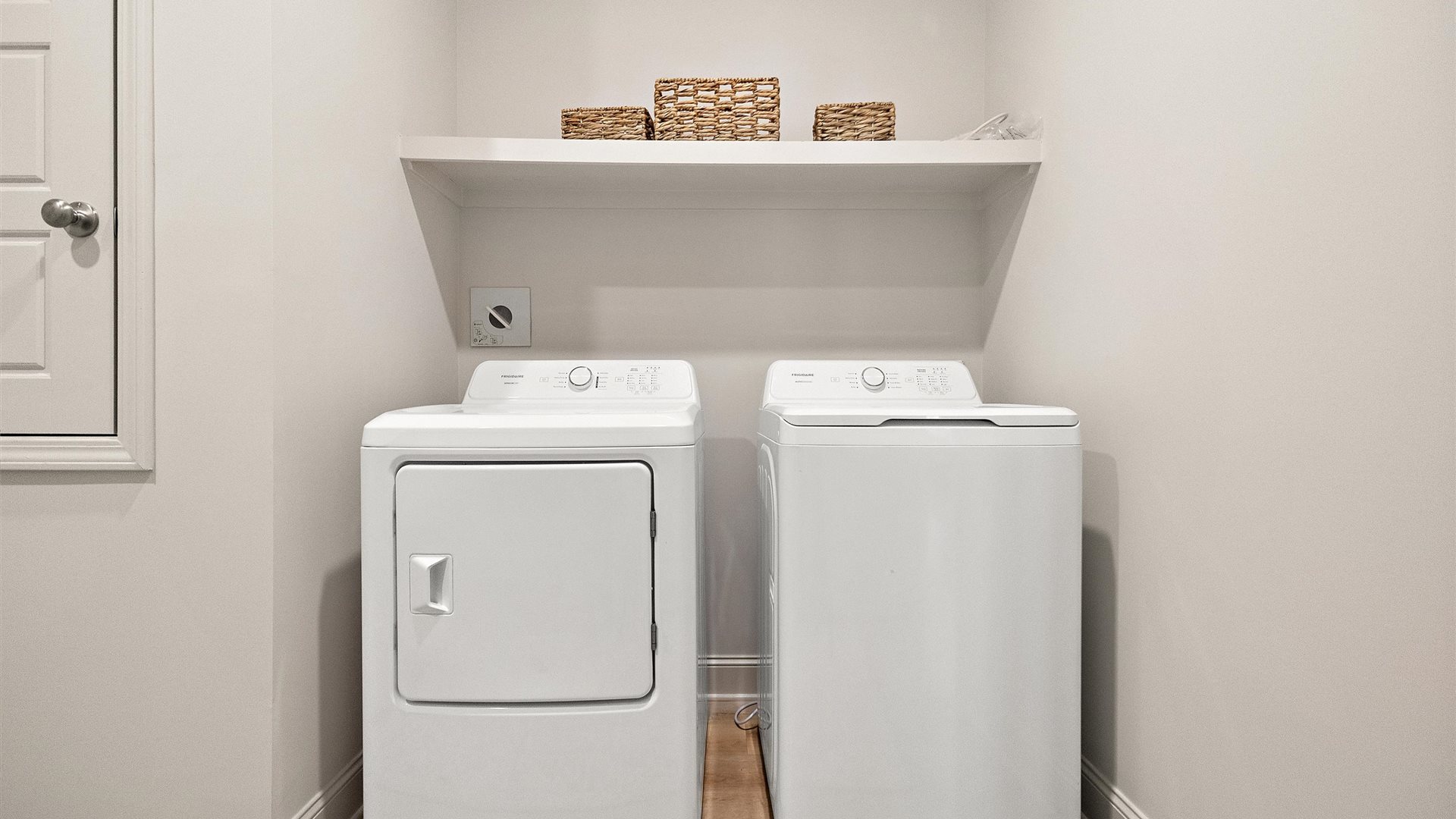 Utility laundry smartly designed with overhead storage, a drop zone, washer, dryer and hookups included Horseshoe Bend model