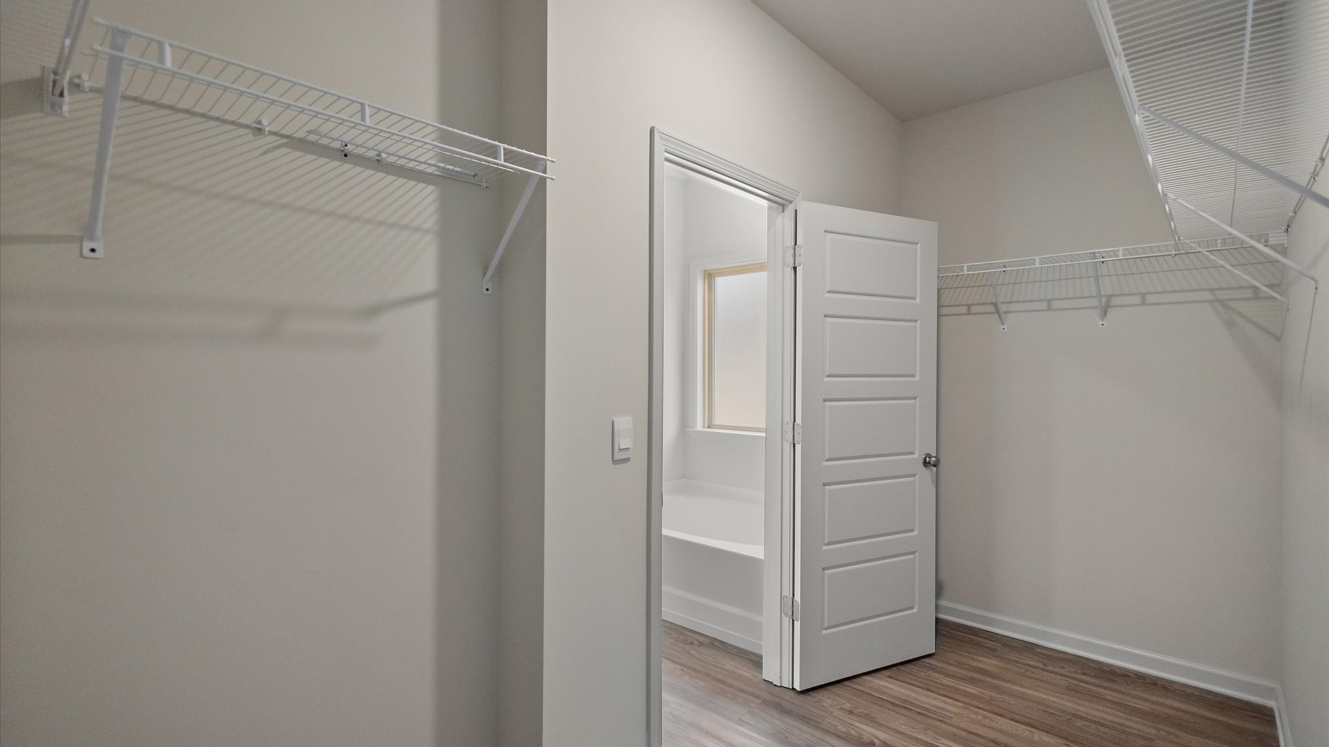 Walk-in closet with built-in shelving.