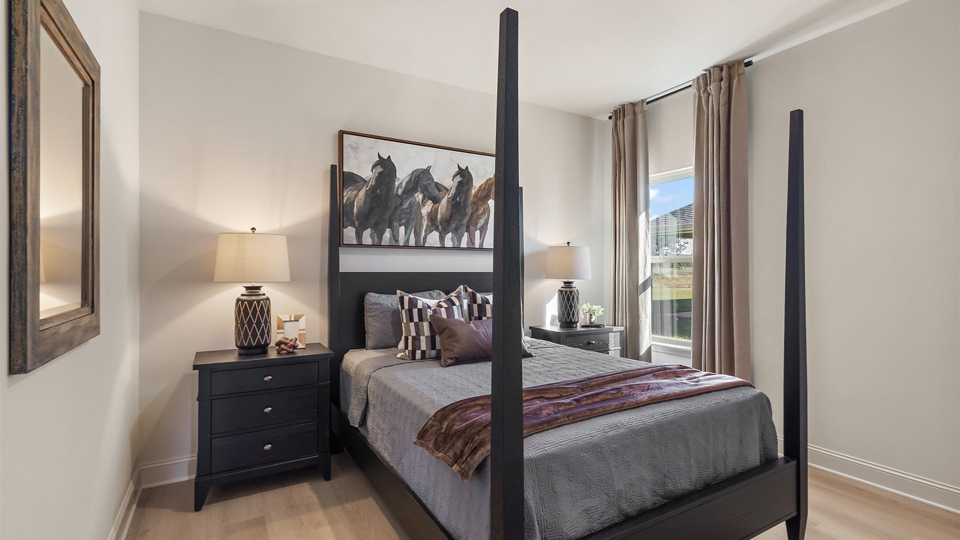 Additional bedroom with window and hardwood floors