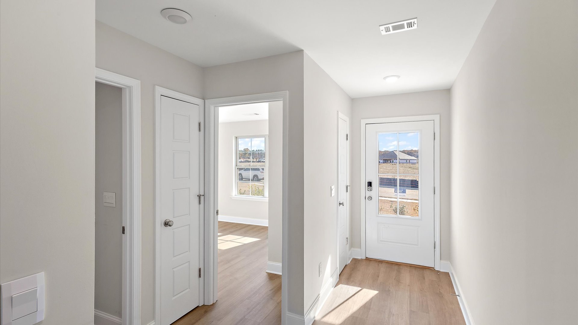foyer showcasing entry door and front room