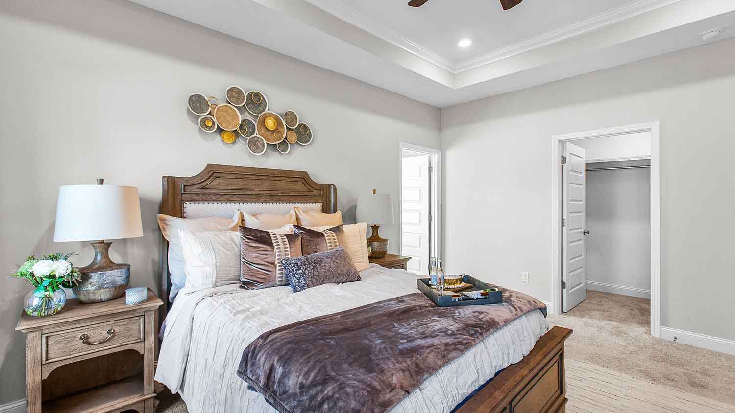 primary bedroom featuring 2 large windows, decorated in rustic brown tones