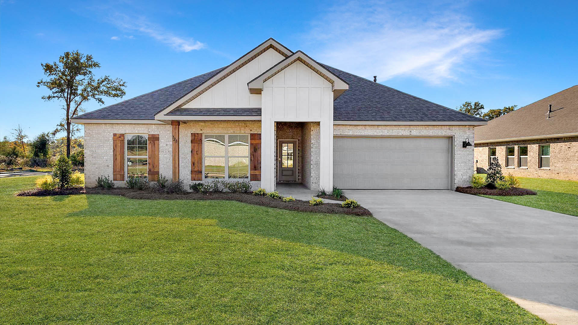 Jasmine single story plan with side entry garage and driveway.