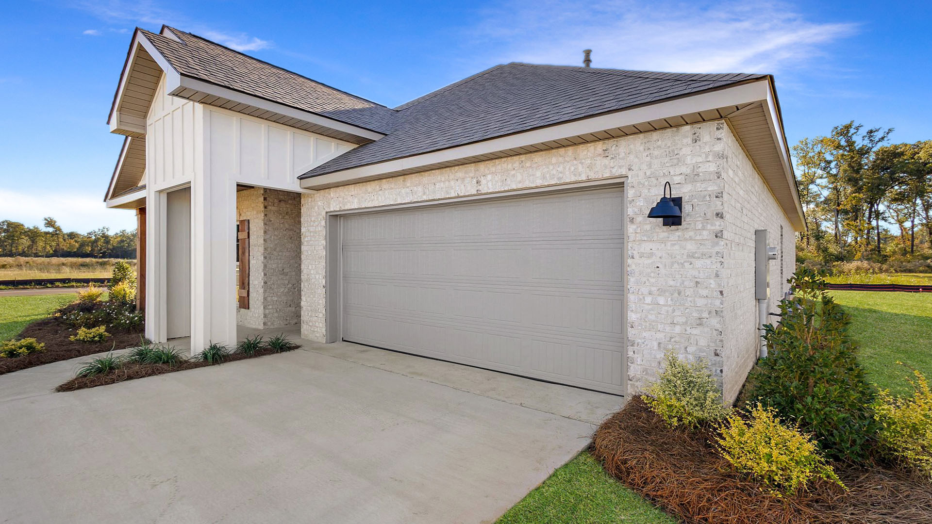 Jasmine single story plan with side entry garage and driveway.