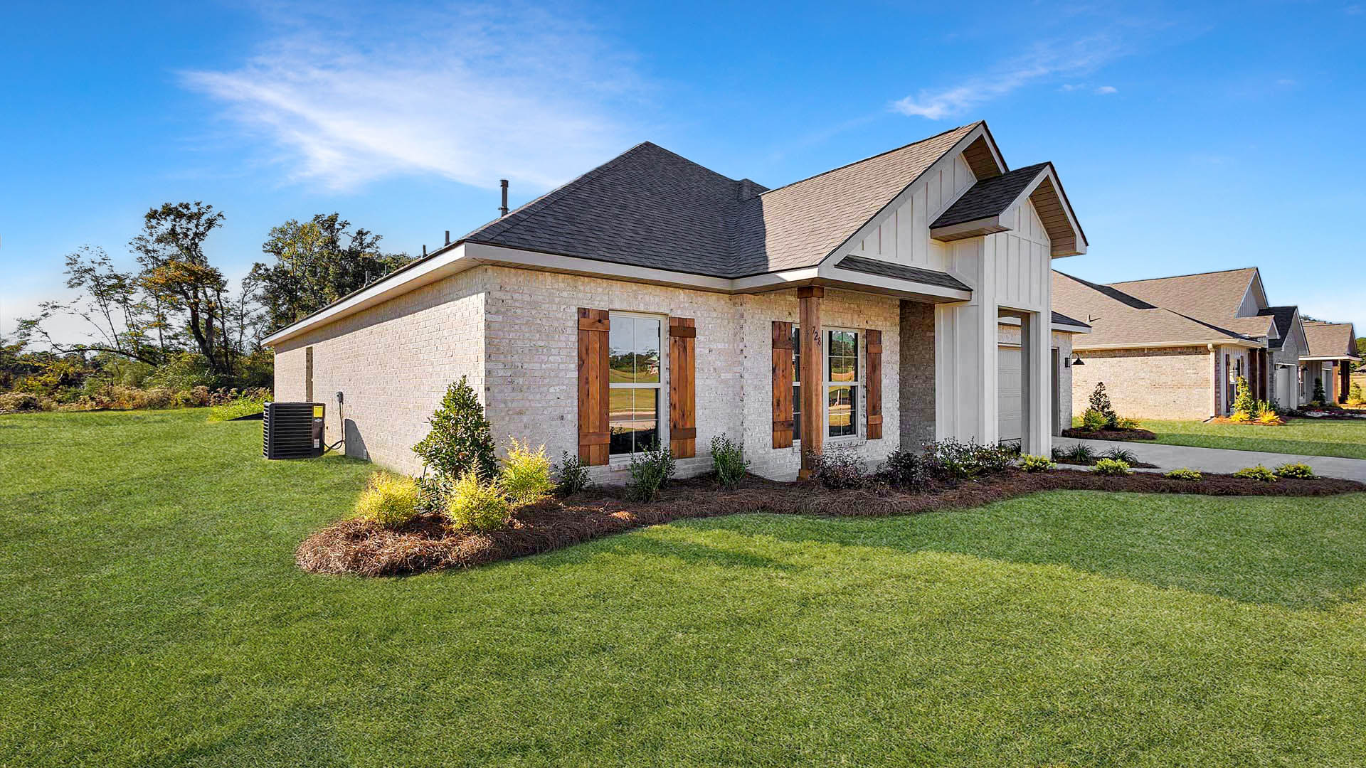 Jasmine single story plan with side entry garage and driveway.
