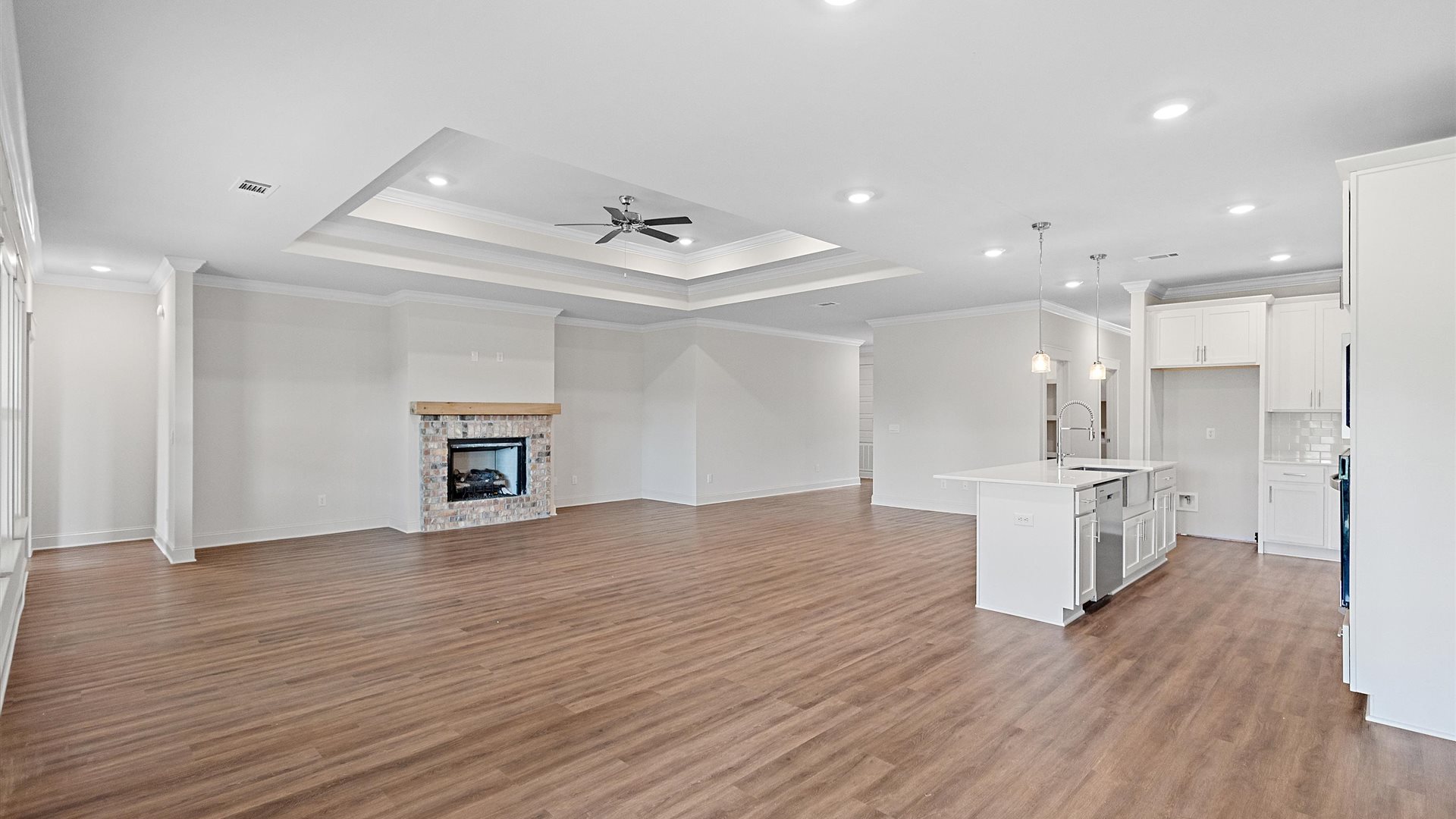 gorgeous living area flowing seamlessly into the modern kitchen