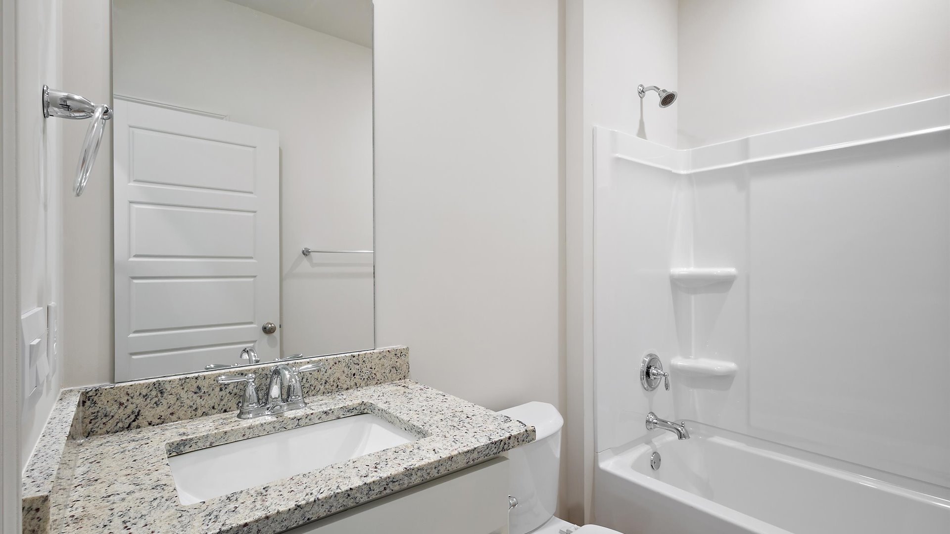 shared single vanity bathroom between bedroom 2 and 3 with shower/tub combination