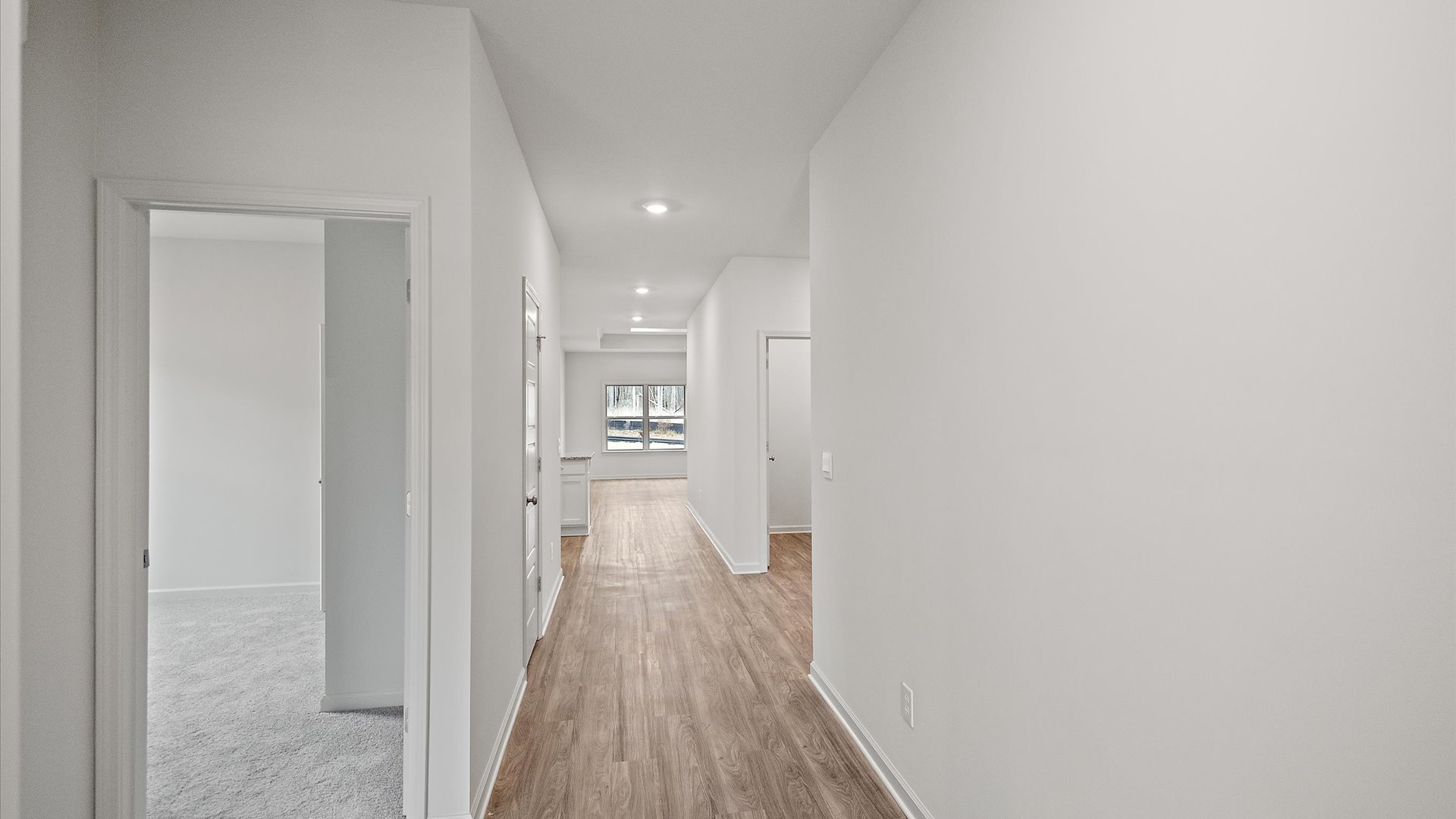 Interior hallway leading to bedroom and bathroom