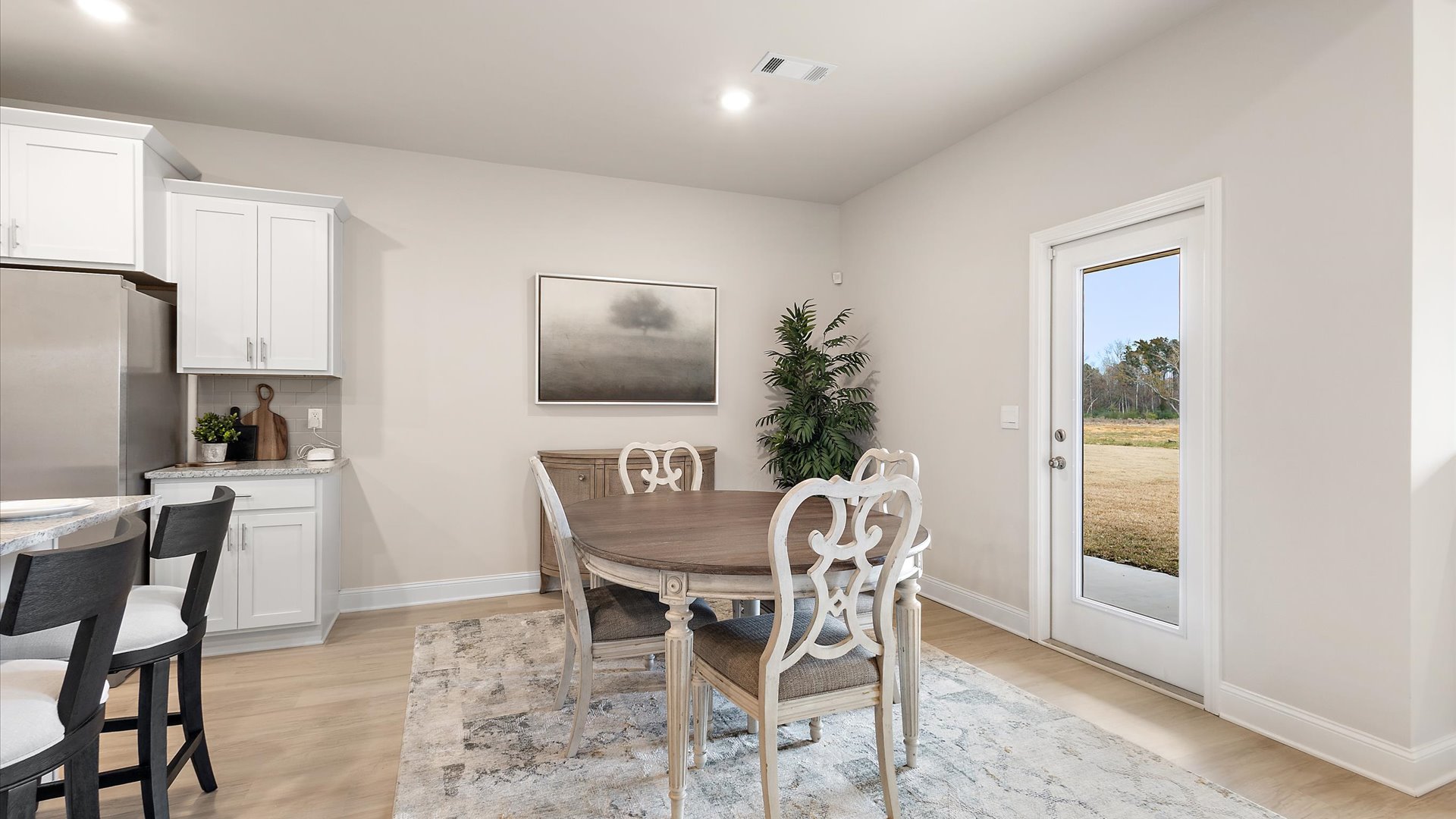 dining area with door leading to patio