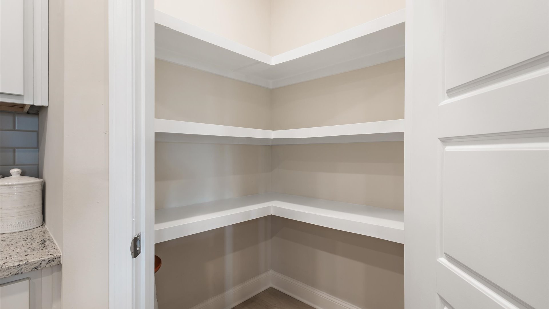 kitchen pantry with wood shelving