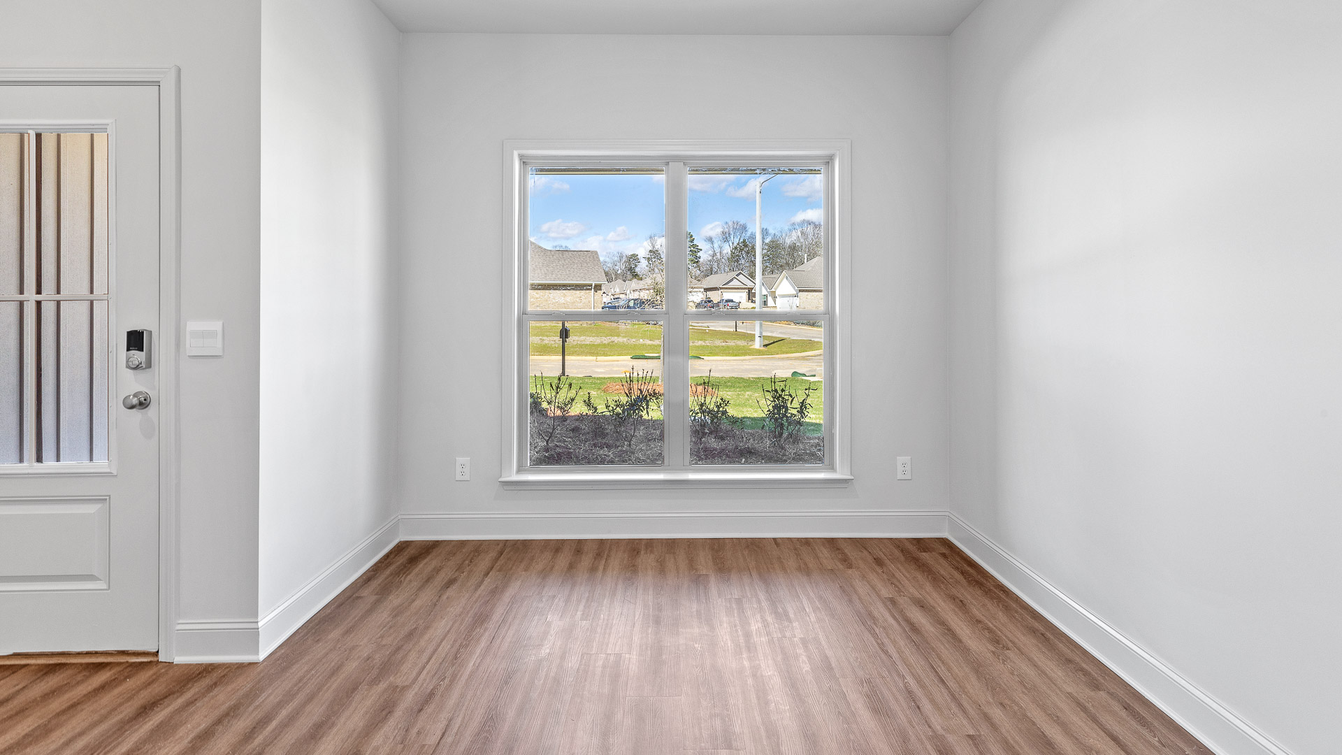 Dining room with a double window.
