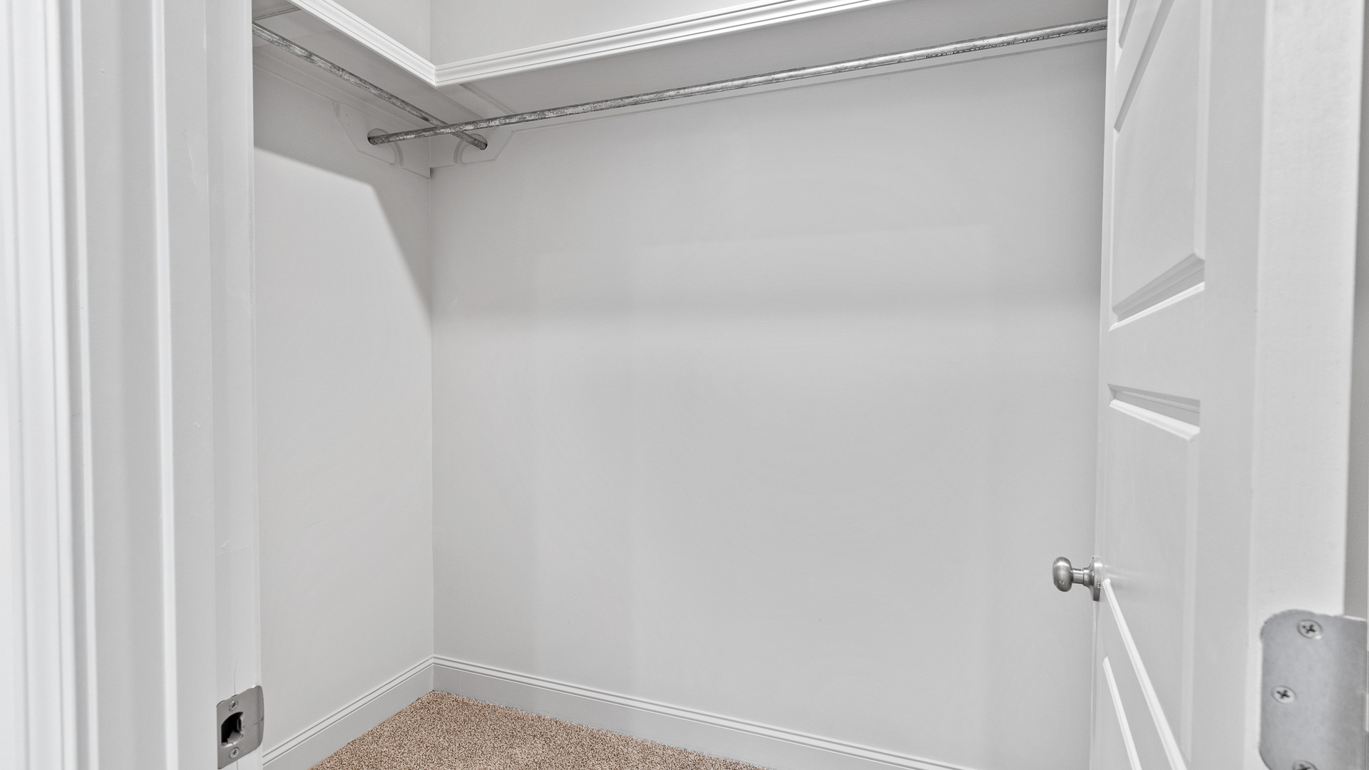 Primary bedroom walk-in closet.