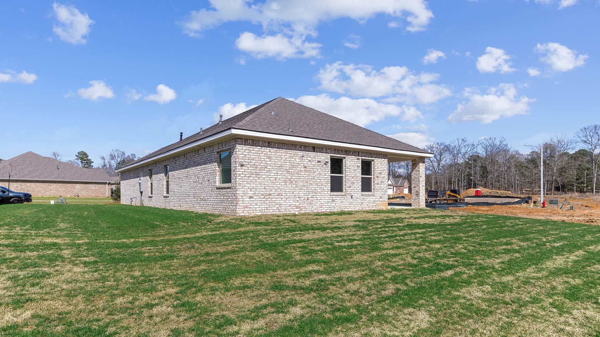 Covered back porch and rear exterior of home.