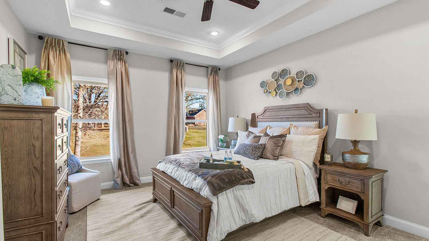 primary bedroom featuring 2 large windows, decorated in rustic brown tones