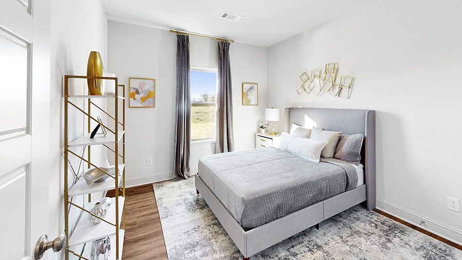 additional bedroom with hardwood floor and window for natural lightt