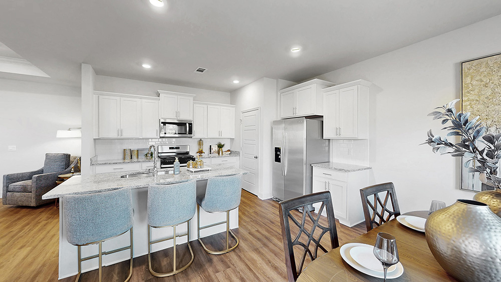 spacious kitchen with granite counters, soft close cabinets, and hardwood floors