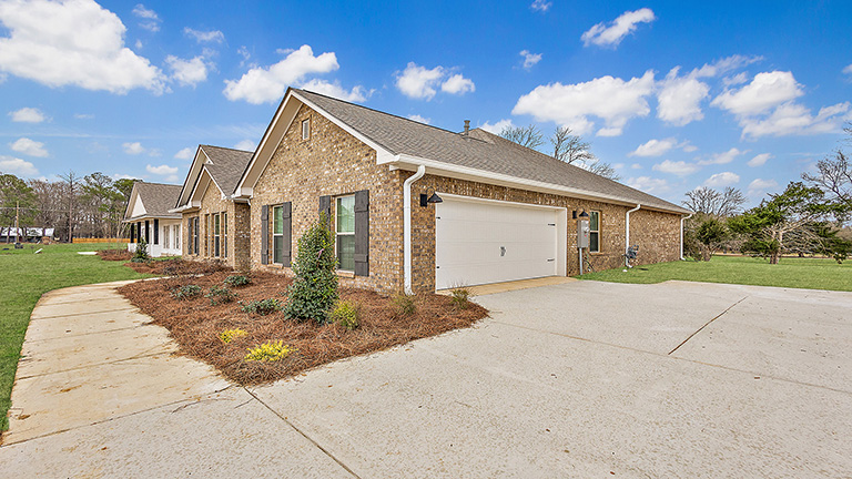 Jasmine single story plan with side entry garage and driveway.