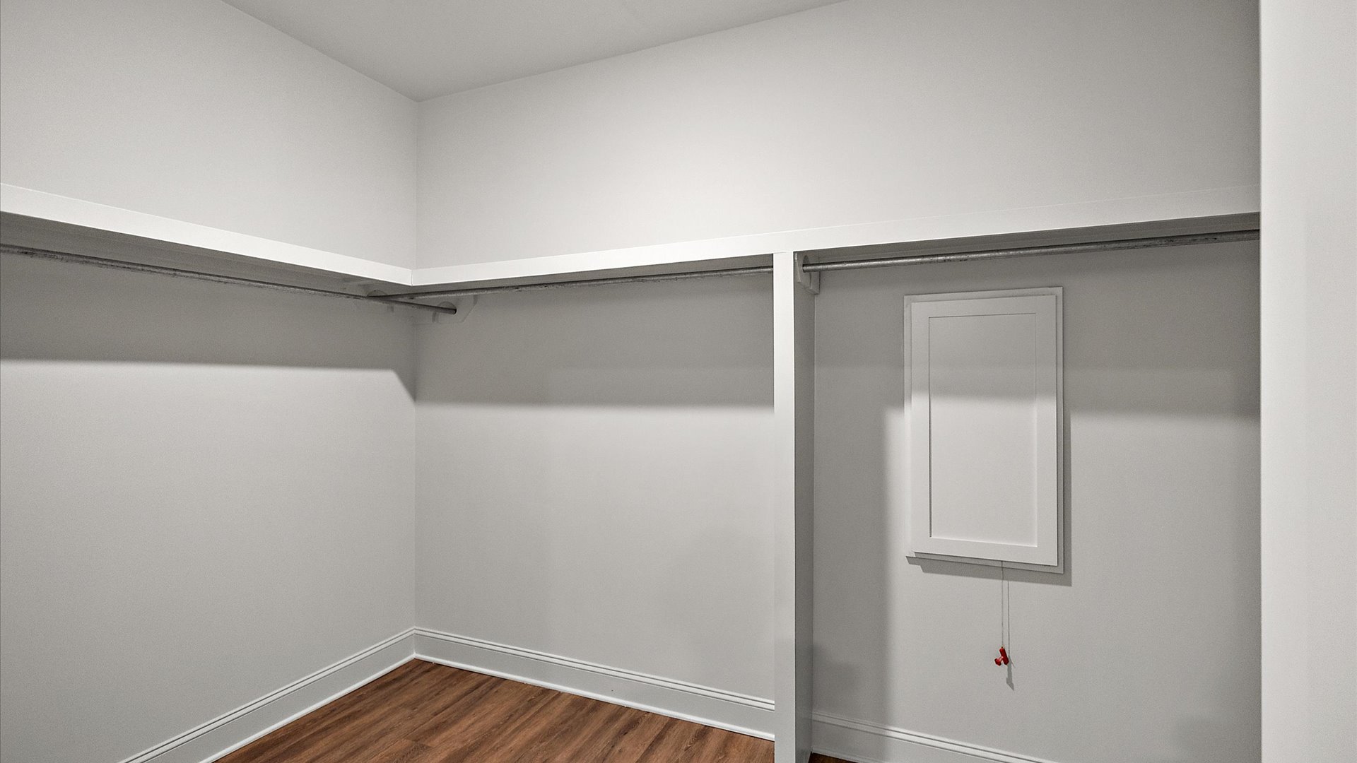 Sizable walk-in closet in primary bathroom.