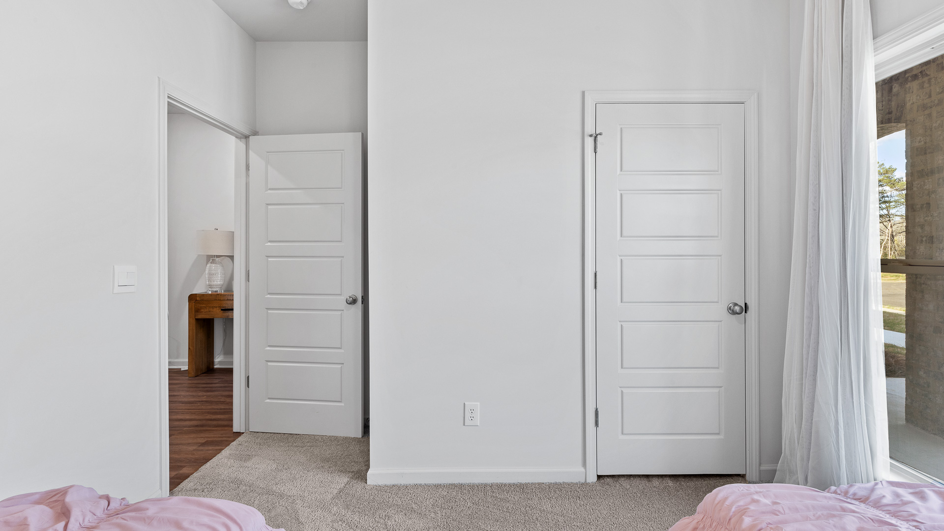 View of the closet and door from this same bedroom