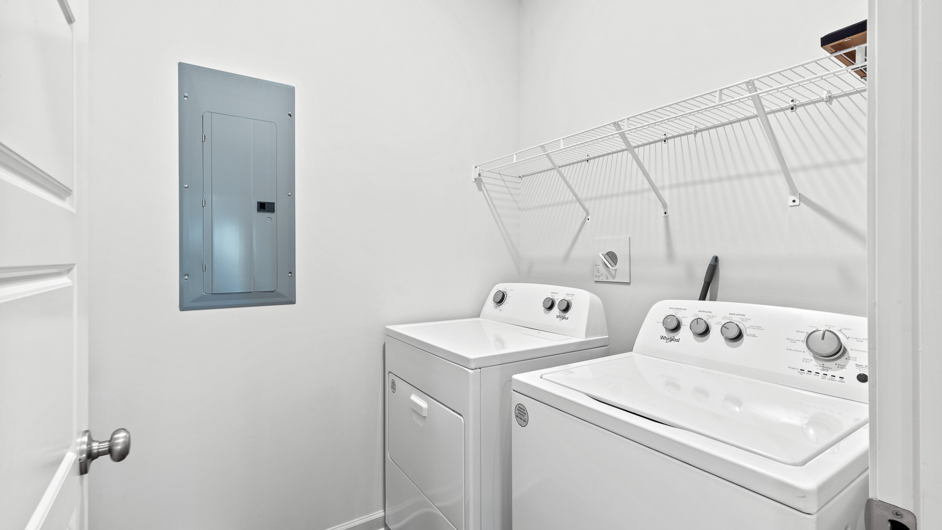 spacious laundry room with side by side washer and dryer