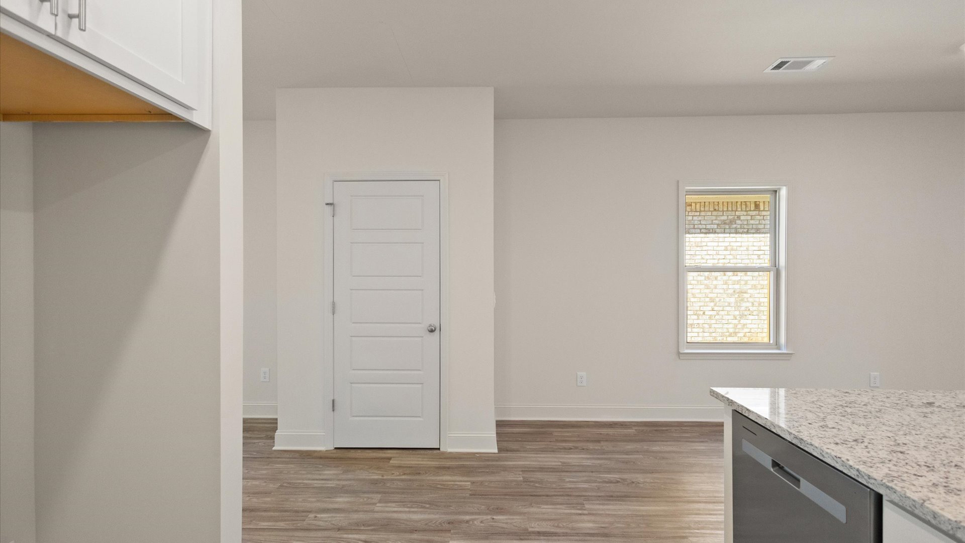 View from kitchen with a window and pantry