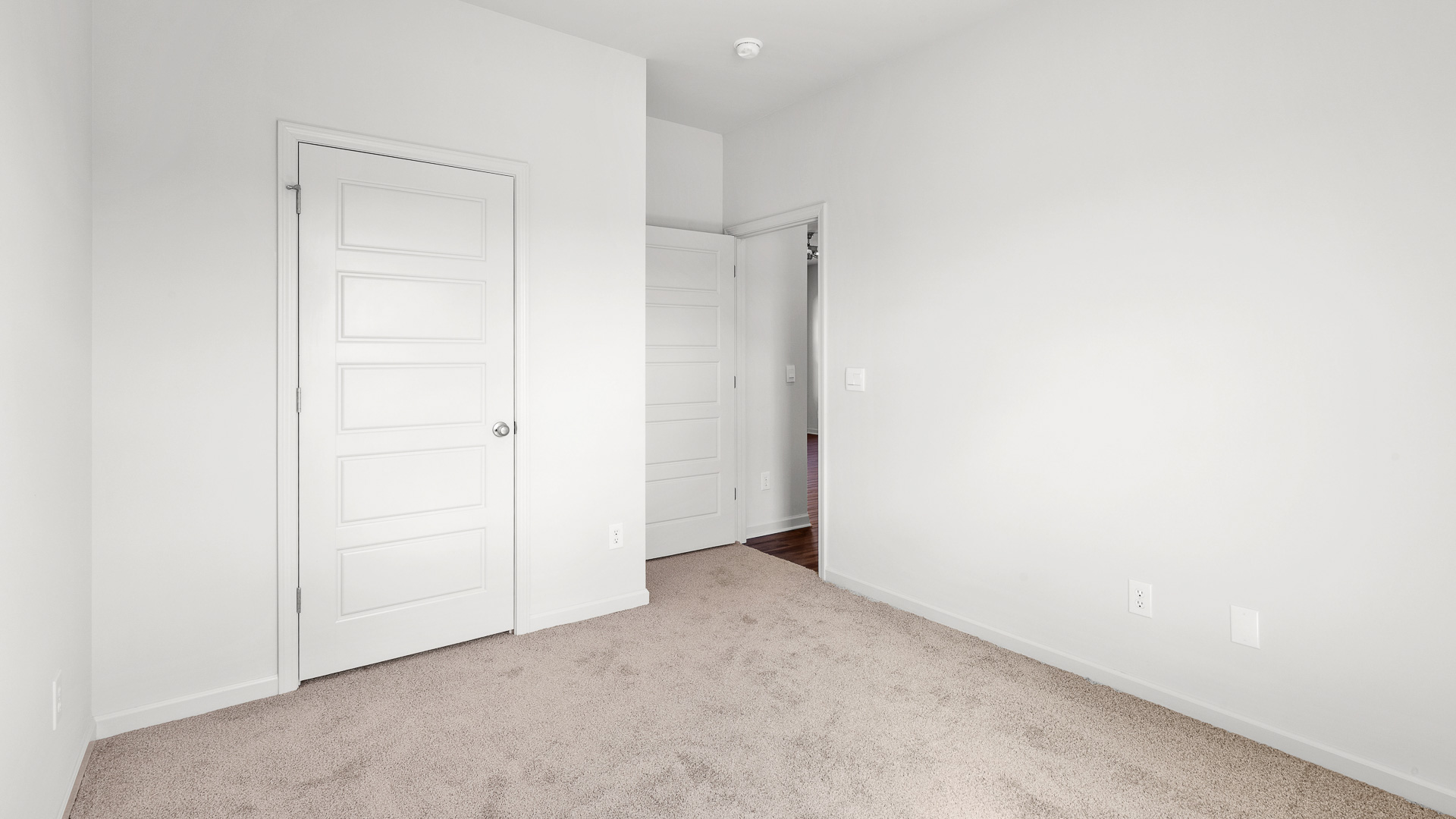 additional bedroom with carpeted floors