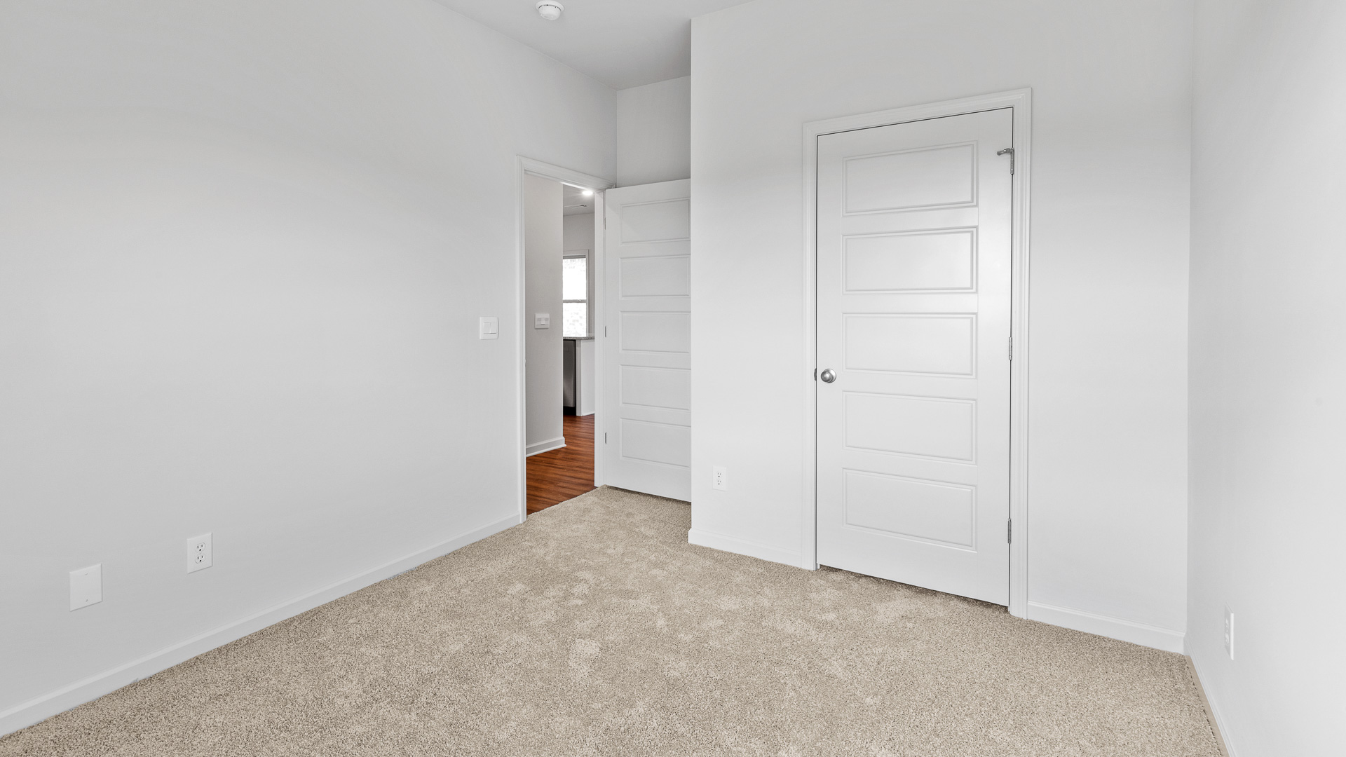 additional bedroom with carpeted floors