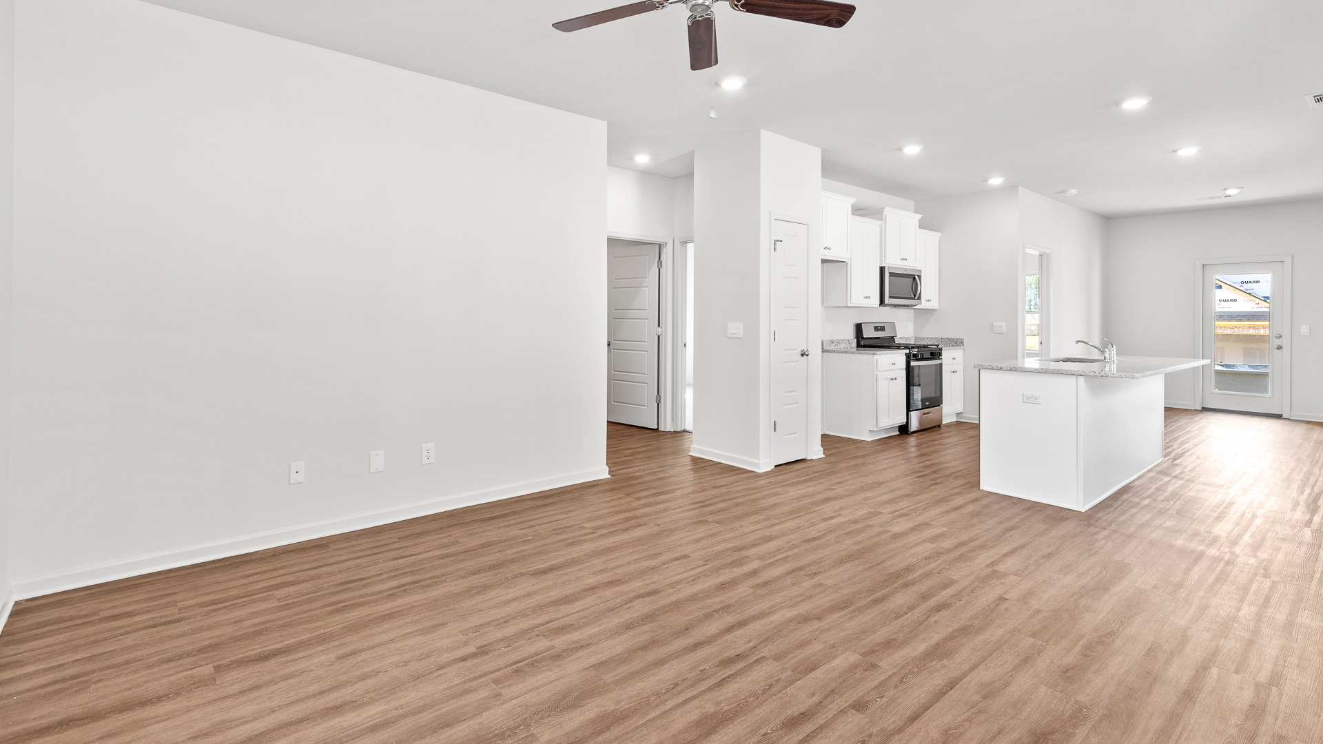 spacious open concept first floor featuring the living room off of the kitchen