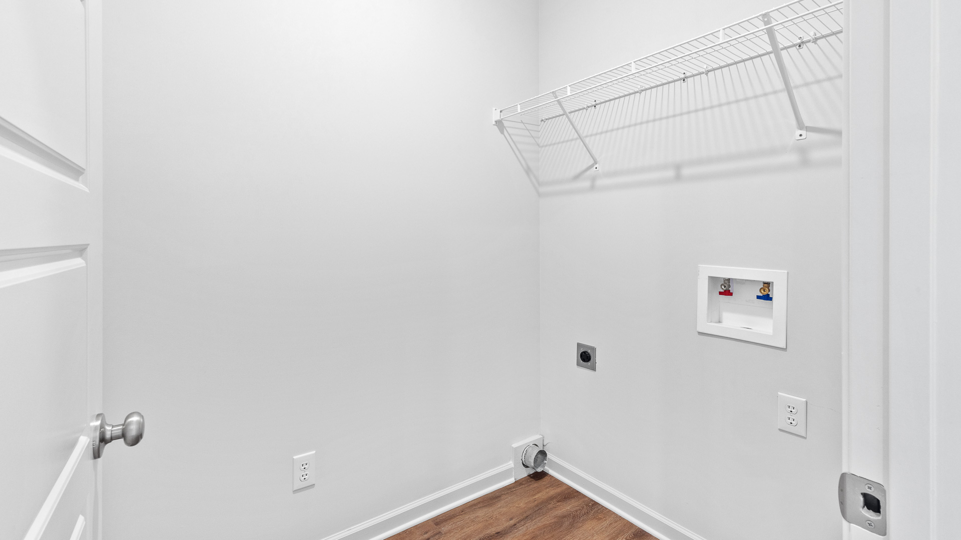 laundry room featuring built in shelves