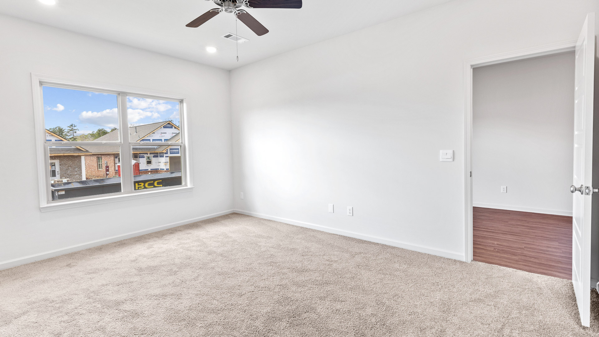bedroom featuring a walk in closet and a large window