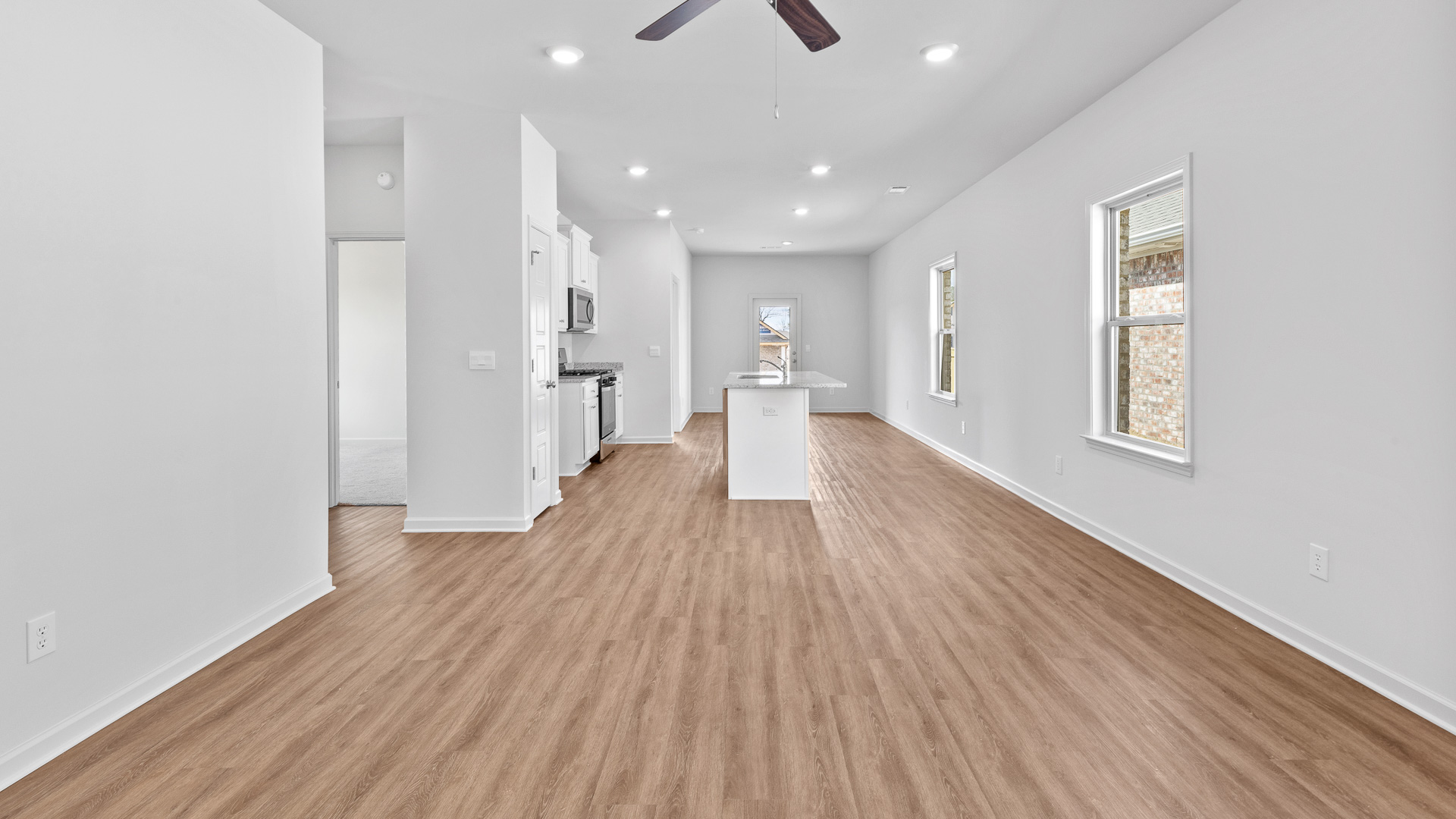 spacious open concept first floor featuring the living room off of the kitchen