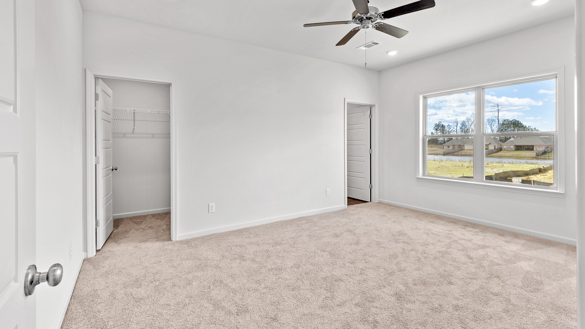 bedroom featuring a walk in closet and a large window