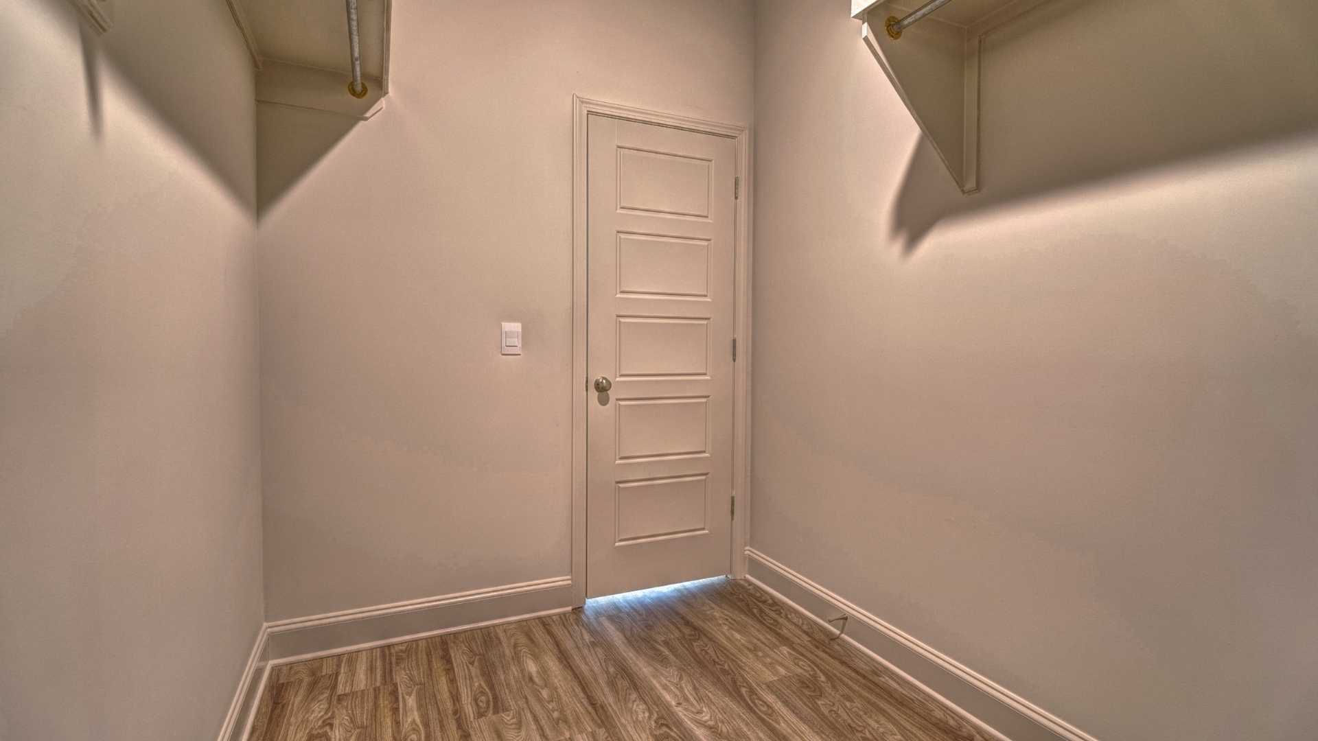 interior walk in closet with some built in shelving