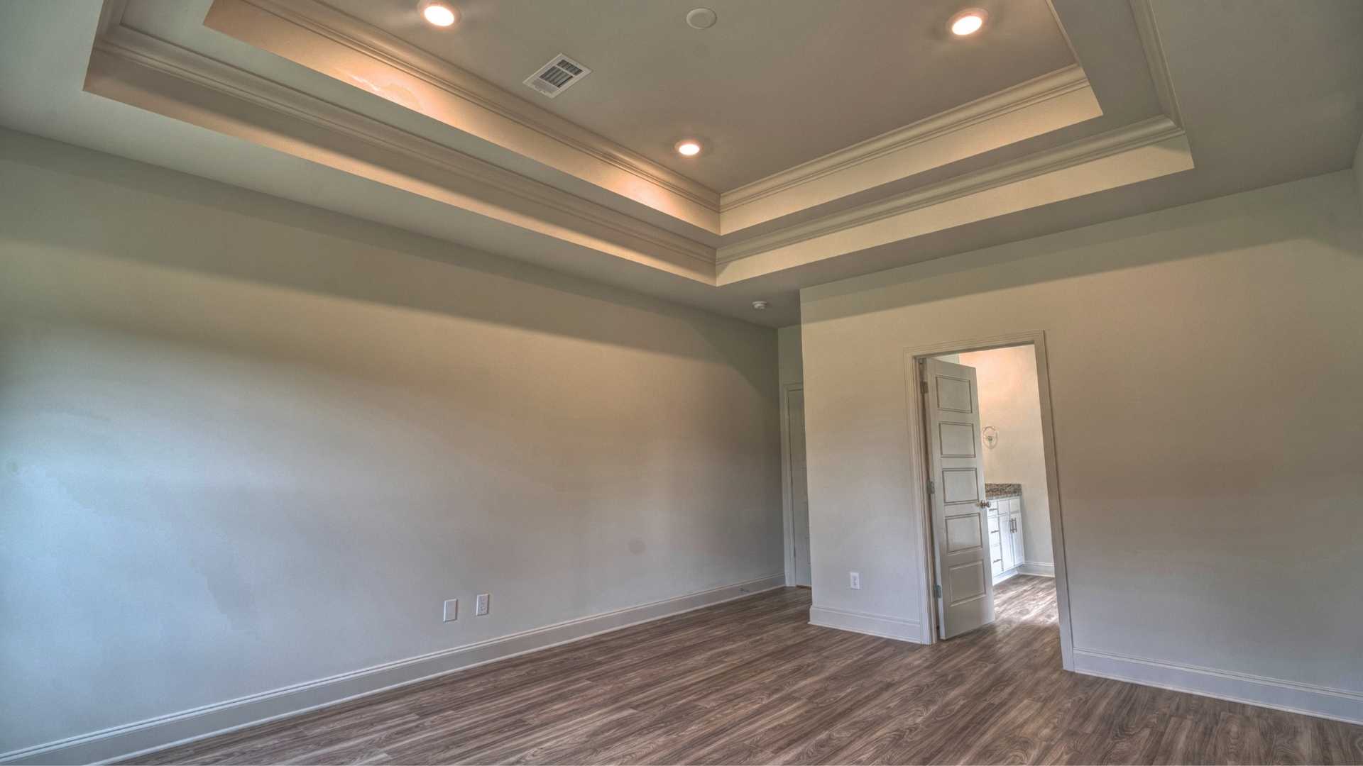 interior bedroom with coffered ceilings
