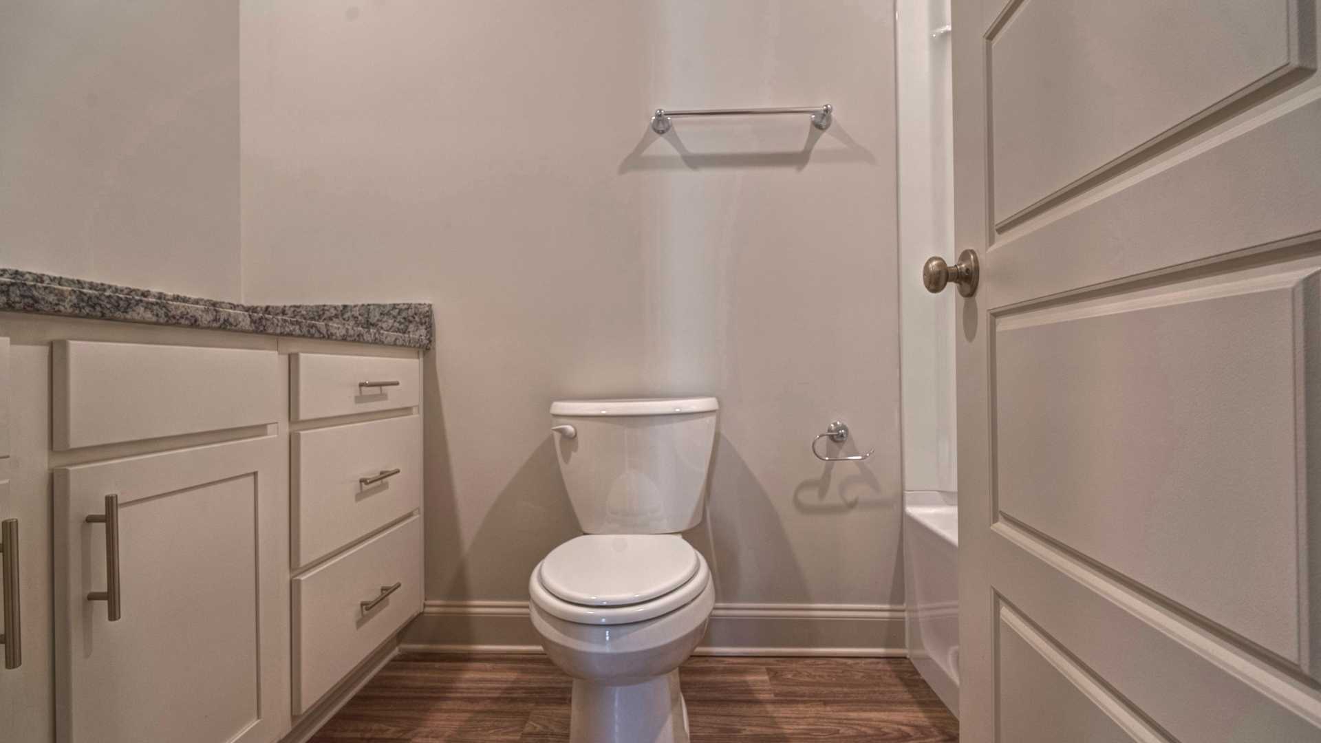 interior bathroom with sink and toiler and full size shower