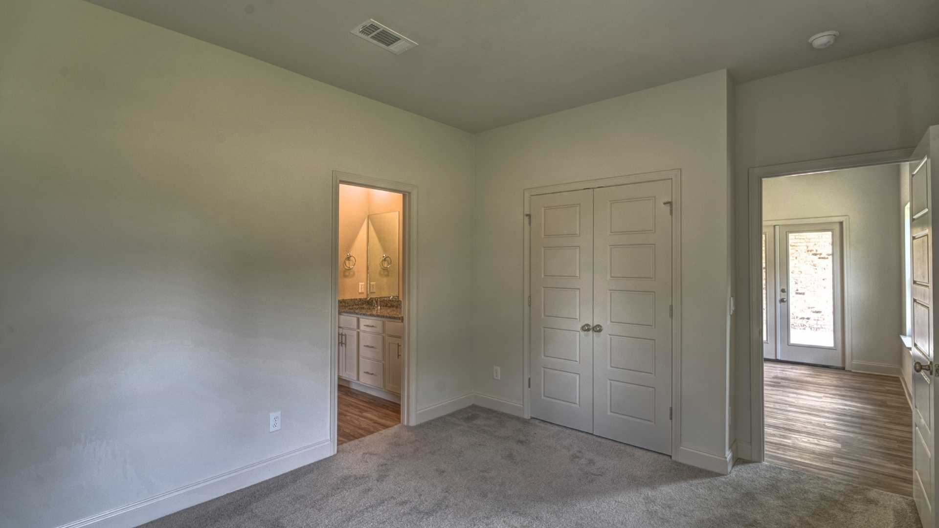 interior bedroom connected to closet and bathroom